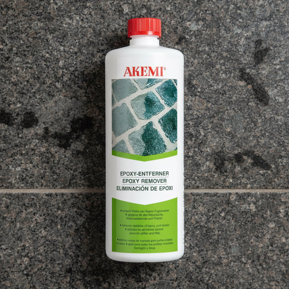 A bottle of Akemi Epoxyfjerner with a label showing a picture of a stone surface.